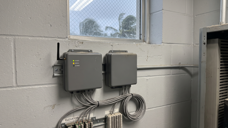 Elevator monitoring control boxes with power, signal, and antenna